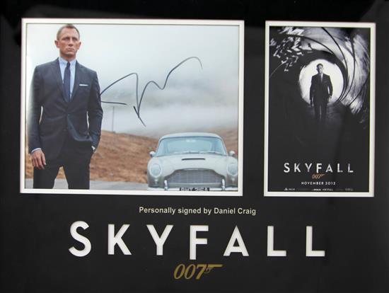 Daniel Craig, Skyfall. A framed autographed photograph montage, overall 17 x 22in.